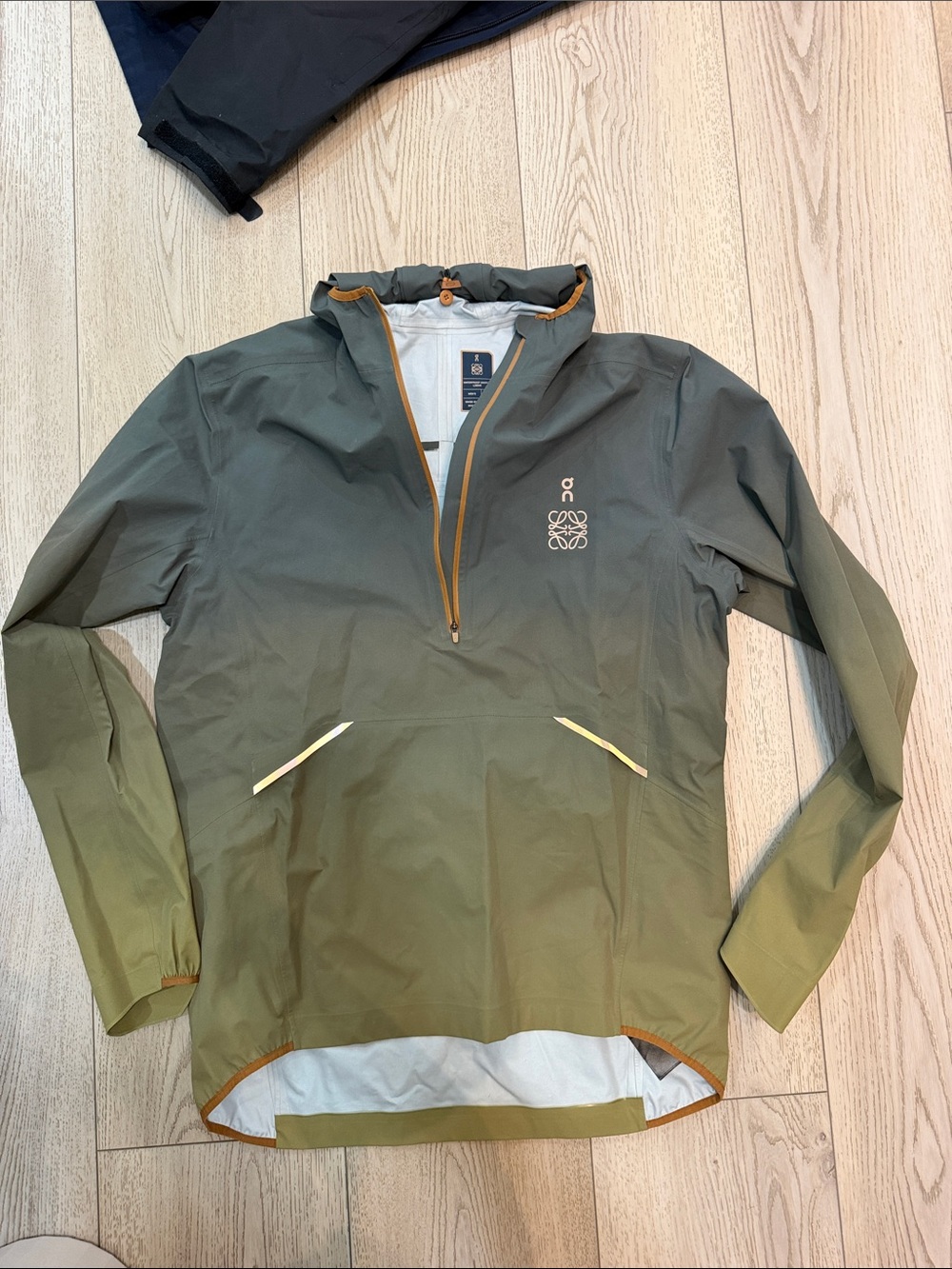 On Running Loewe Olive Green Hooded Windbreaker with Gold Trim